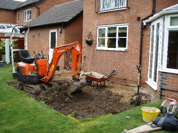 Our Micro-Digger was able to fit between the house and garage no problen to start the work.