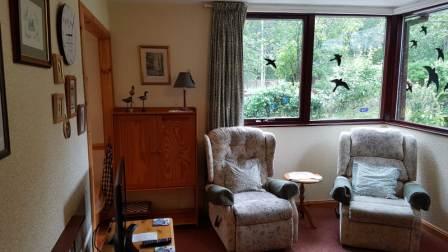 Lounge with Comfy Recliners & TV & Bird & Squirrel Nut Station